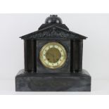 A late Victorian architectural slate mantle clock,