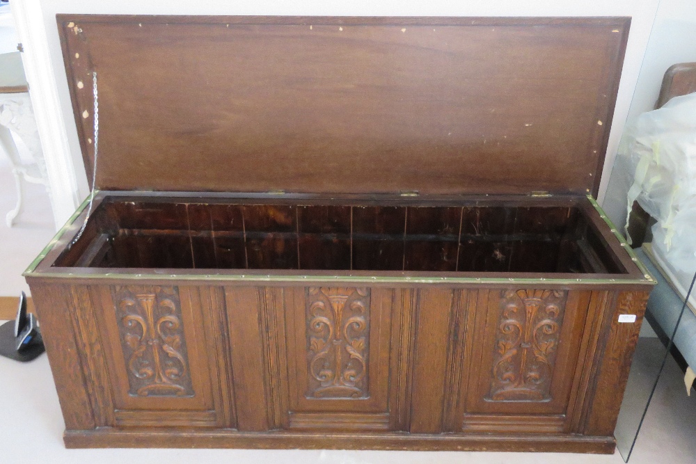 A carved oak panel fronted marriage chest, lid lifting to reveal plain compartment within, - Image 2 of 2