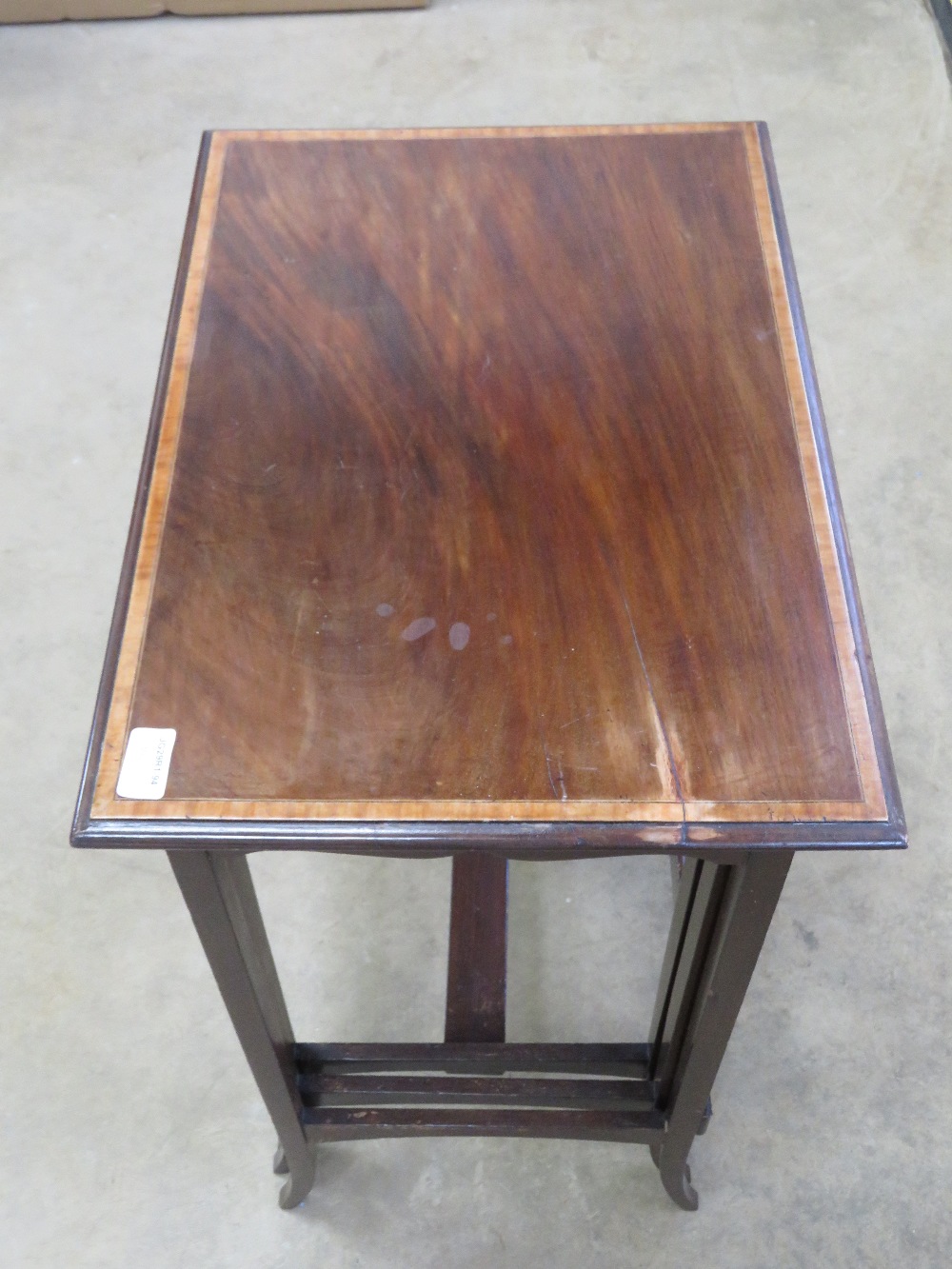 A good Edwardian nest of three mahogany tables each crossbanded with walnut and raised over slender - Image 3 of 3
