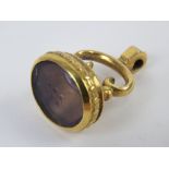 A gilt metal fob having foil backed 'Say Yes' seal (slightly a/f), fob 3cm in length, base 2 x 1.