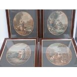 A set of twelve months of the year re-struck oval mounted prints in wooden frames,