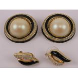 A pair of vintage Christian Dior stud earrings having black enamel and white stones upon,