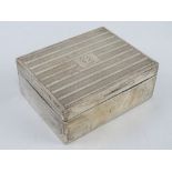 An HM silver cigarette box having cedar wood lining, engraved to lid 'Vice G.C. 1929', measuring 10.
