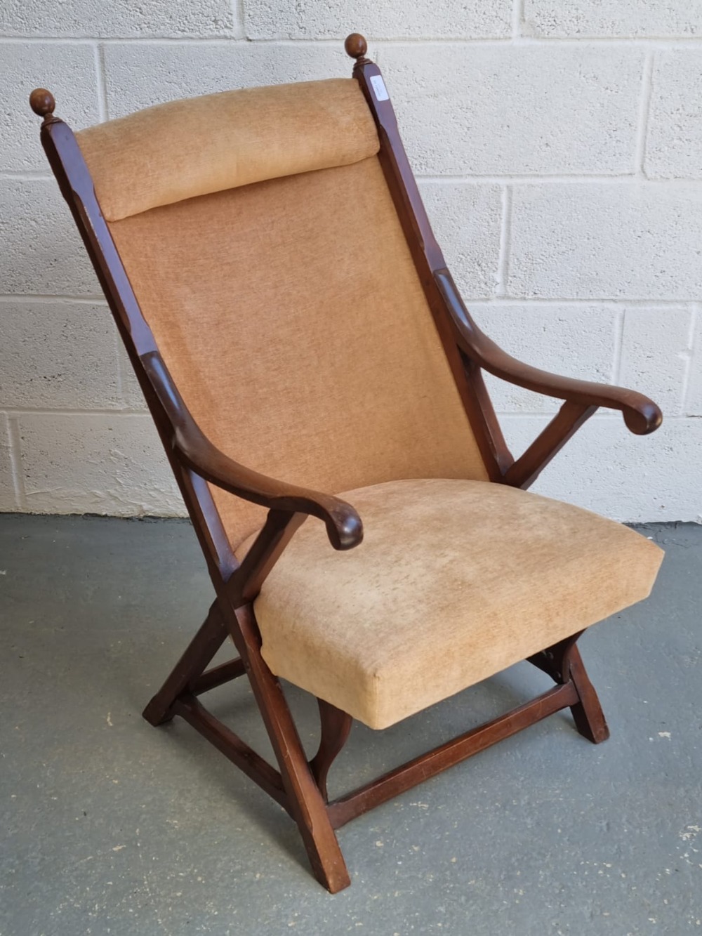 An Edwardian mahogany framed library chair having chamfered decoration throughout,