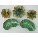 Three Victorian majolica ware leaf dishes, together with a pair of cabbage ware plates. a/f.