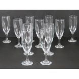 A set of eleven champagne flutes.