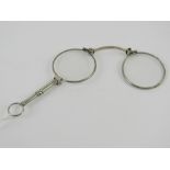 A pair of Art Deco folding lorgnette spectacles, having chatelaine loop,
