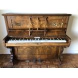 A good inlaid walnut upright overstrung piano by Monk & Schuppisser Ld of London as retailed by GS