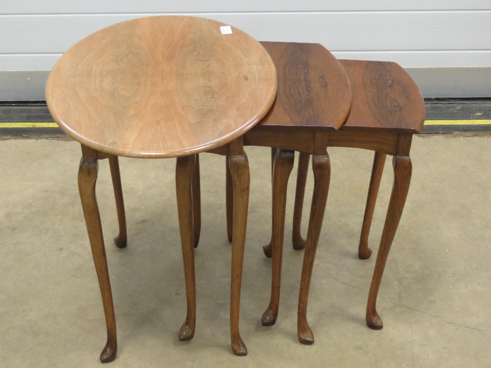 A nest of three 20th century walnut tables raised over slender taping legs, 60, - Image 2 of 2