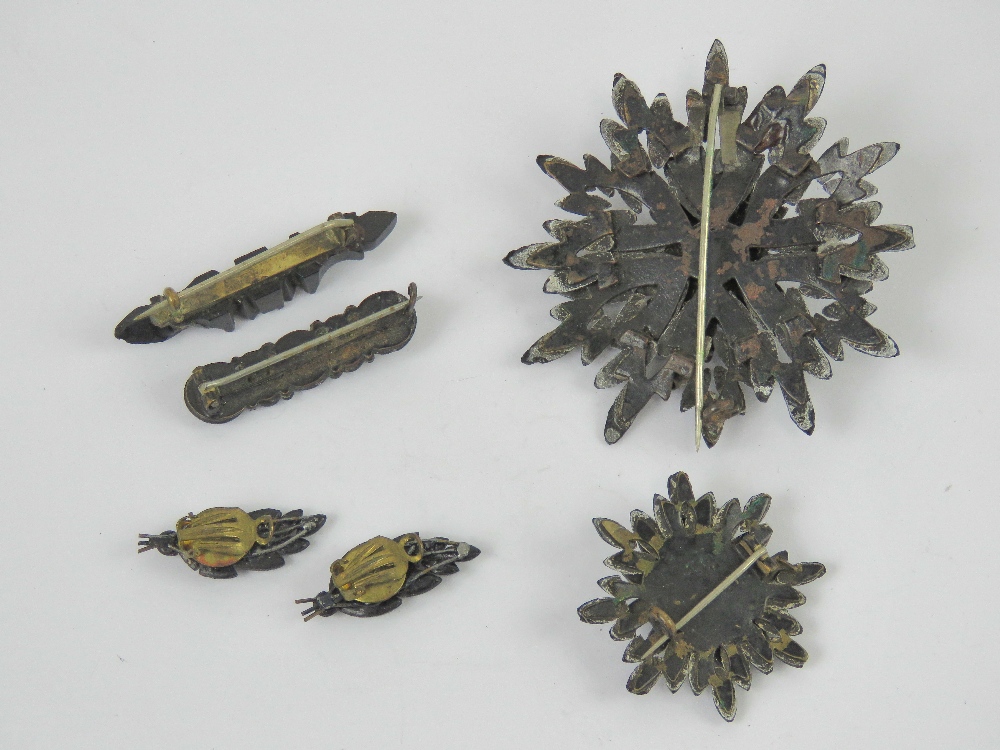 Four French jet brooches, one with matching pair of clip on earrings. - Image 3 of 3