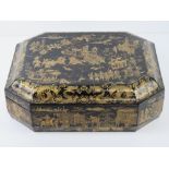 A Chinese export black laquer and gilt decorated games box, 19thC, of octagonal form,