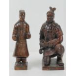 A pair of hand carved wooden samurai figurines, early 20th century, each 20cm high.