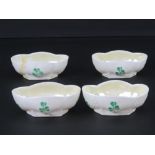 A rare set of four Belleek quatreform caviar bowls, each hand painted with clover upon,