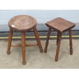 An elm top stool having four turned legs united by turned stretcher, 30cm dia, 37cm high.