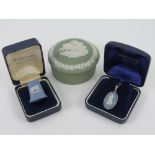 A HM silver and Wedgwood blue Jasperware pendant on silver chain, in original box.