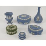 Five items of blue Wedgwood Jasper ware together with a single green item.