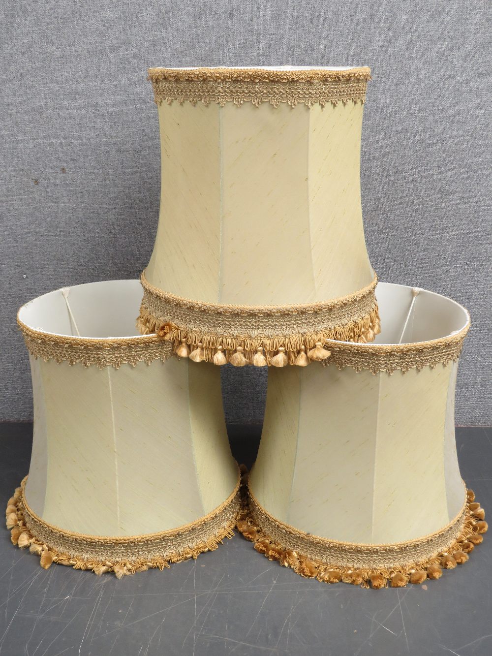 A set of three silk lamp shades approx 39cm dia.