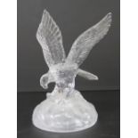 A glass paperweight in the form of an eagle standing 20cm high, no apparent maker's mark.