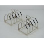 A pair of HM silver toast racks, each hallmarked Birmingham 1935,