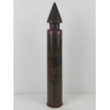 An inert WWII Russian T34 76mm shell, dated 1943. 54cm high.