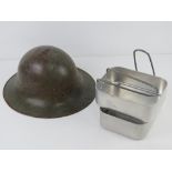 A WWII British Zucherman helmet, no liner, dated 1941. Together with a mess tin.