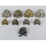 A quantity of assorted reenactors Totenkopf 'Deaths Head' badges including one marked RZM 215/41 SS