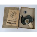 A WWII German civilian gas mask and filter in box with instructions, having German marks.