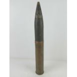 An inert WWII German 8cm M30 shell with head and fuse, having German marks upon and dated 1940,