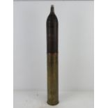 An inert WWII German 7.5cm Kwk40 hollow charge shell, some original markings to head and fuse.