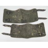 A pair of WWII German gaiters having leather straps.