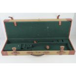 A canvas and leather 'Guardian' gun case having combination lock,