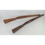 Two KAR98 wooden stocks, one has a makers mark dot and serial number 9669.