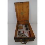A WWII German ammunition wooden crate with accessories, bearing label within and dated 1940,