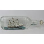 A large ship in gallon bottle model of the Cutty Sark and Gipsy Moth, 50cm in length.