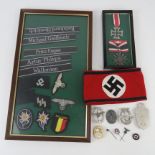A quantity of assorted reproduction WWII German badges,