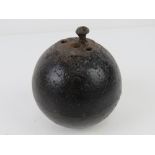 An inert WWI British No.15 'cricket ball' grenade.