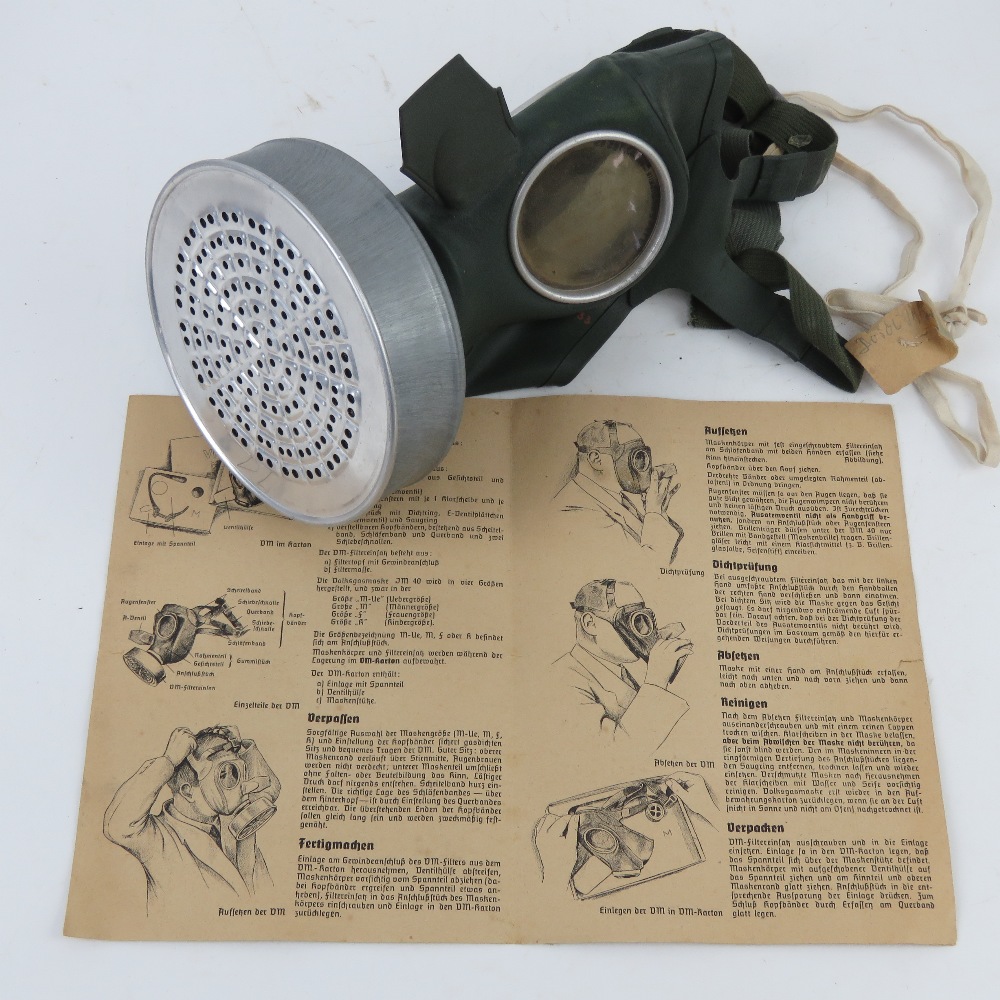 A WWII German civilian gas mask and filter in box with instructions, having German marks. - Image 2 of 4