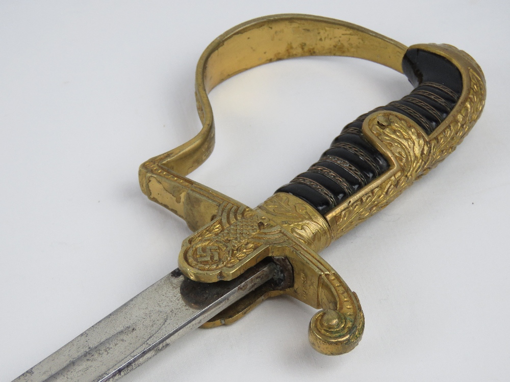 A WWII German Officer's sword with scabbard, bearing makers mark on the blade for Eikhorn Solingen, - Image 5 of 6