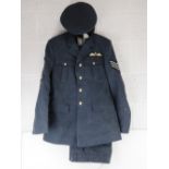 An RAF No1 Dress uniform with peaked cap, having cloth patches upon.