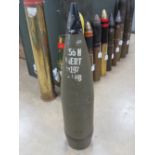 An inert 155mm projectile with fuse standing 70cm high.
