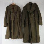 Two WWII British Army Great Coats, both stamped, labeled and dated.