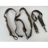 Three MG34 leather slings with fittings at both ends of each sling.