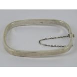 A HM silver rectangular hinged bangle with safety chain, 6 x 5.