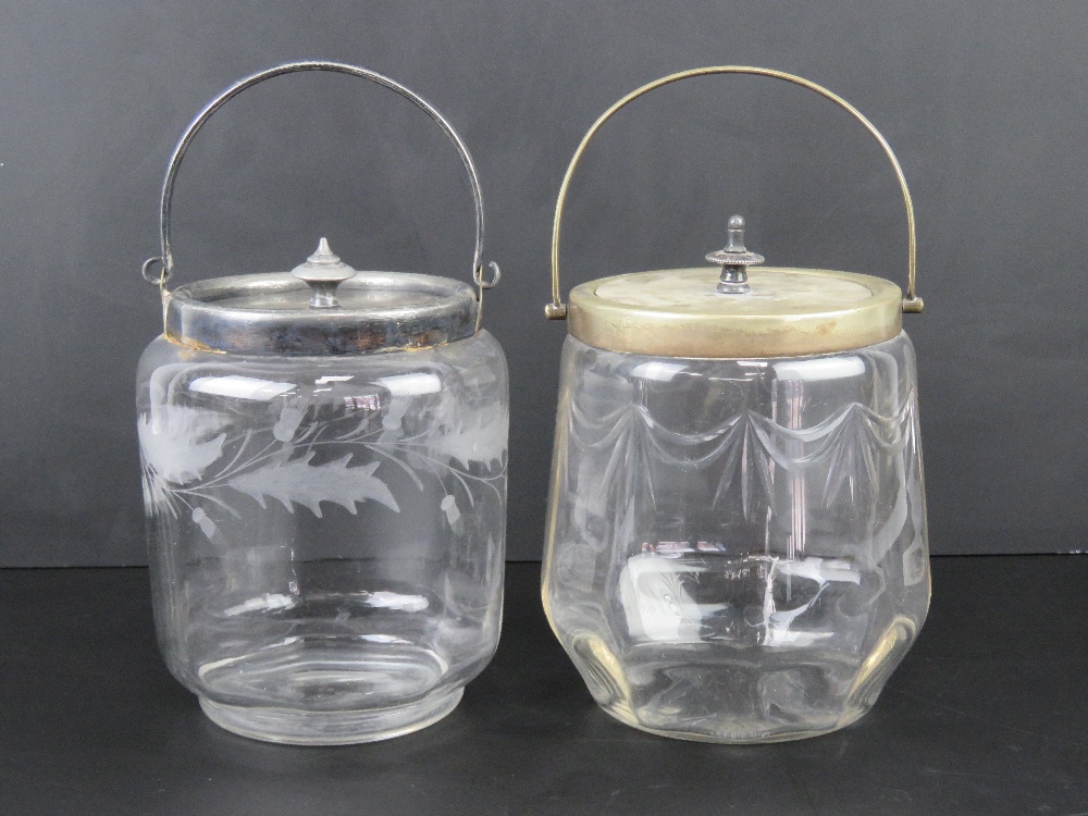 Two glass wafer / biscuit barrels, one etched, one cut, each with nickel plated lids and handles.