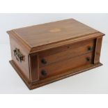 A mahogany cutlery box cross banded with walnut opening to reveal (empty) baize lined cutlery