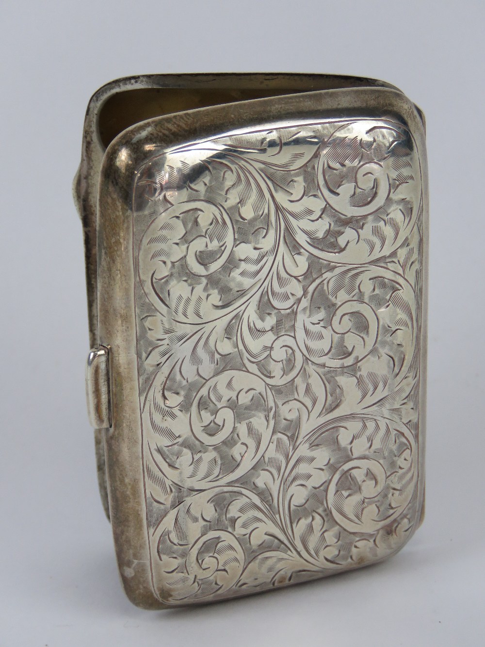 A HM silver cigarette case having scrolling foliage engraved upon and gilded interior, - Image 2 of 3