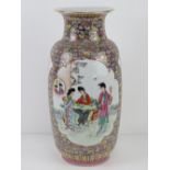 A large Chinese shoulder vase having female figures upon with pink and blue floral decoration and