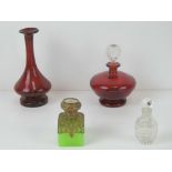 A ruby glass perfume bottle having clear glass stopper together with similar ruby glass vase,