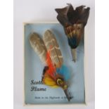 Two Scottish plume brooches one upon original card approx 11cm in length.