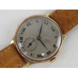 A vintage 9ct gold manual wristwatch having silvered dial with subsidiary seconds dial and blue